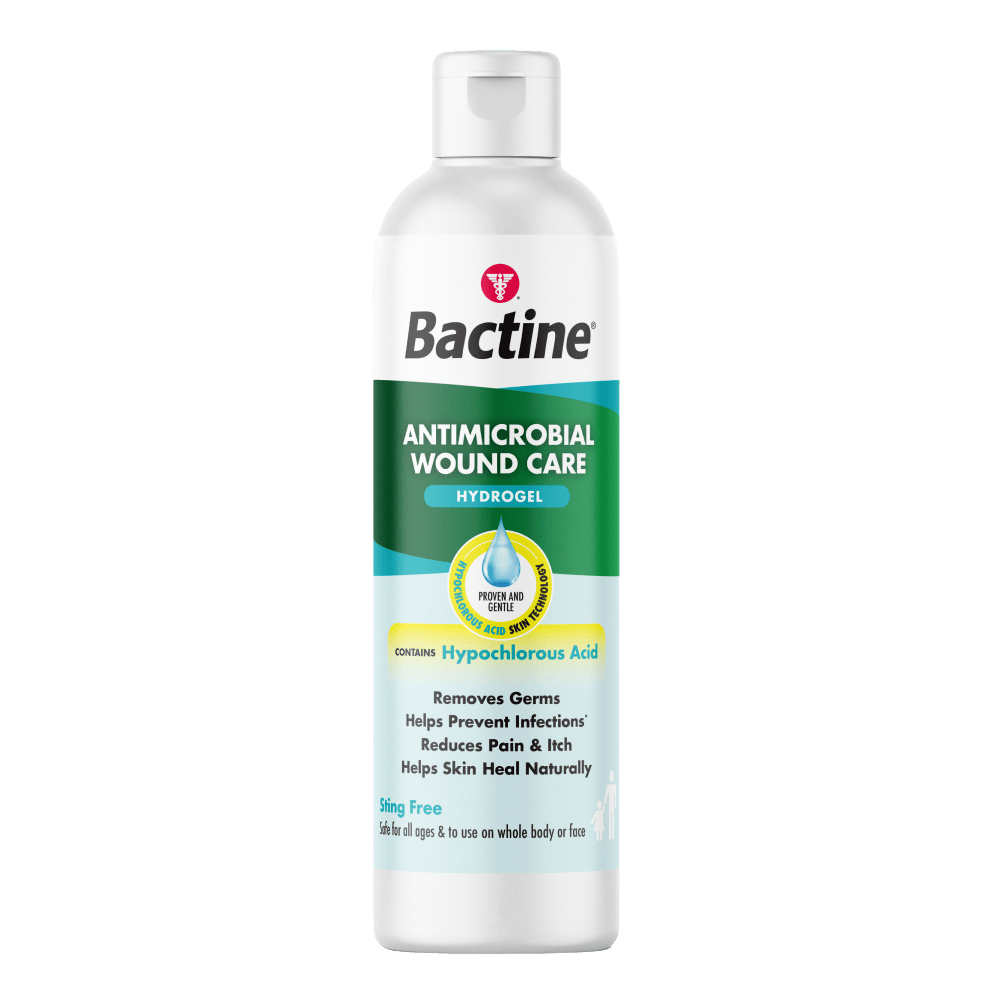 White bottle with a green and turquoise label. Label text: “Bactine®”; “ANTIMICROBIAL WOUND CARE”; “HYDROGEL”; “HYPOCHLOROUS ACID SKIN TECHNOLOGY”; “PROVEN AND GENTLE”; “CONTAINS Hypochlorous Acid”; “Removes Germs”; “Helps Prevent Infections*”; “Reduces Pain & Itch”; “Helps Skin Heal Naturally”; “Sting Free”; “Safe for all ages & to use on whole body or face”.