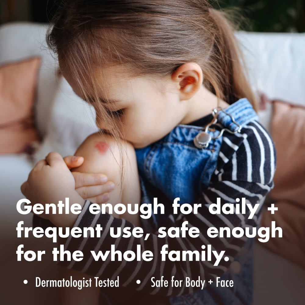A young girl holds her knee with a visible scrape. Text: “Gentle enough for daily + frequent use, safe enough for the whole family.”; “Dermatologist Tested”; “Safe for Body + Face”.
